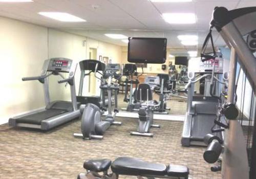 A fully equipped gym at Crossings at Stanbridge apartments for rent